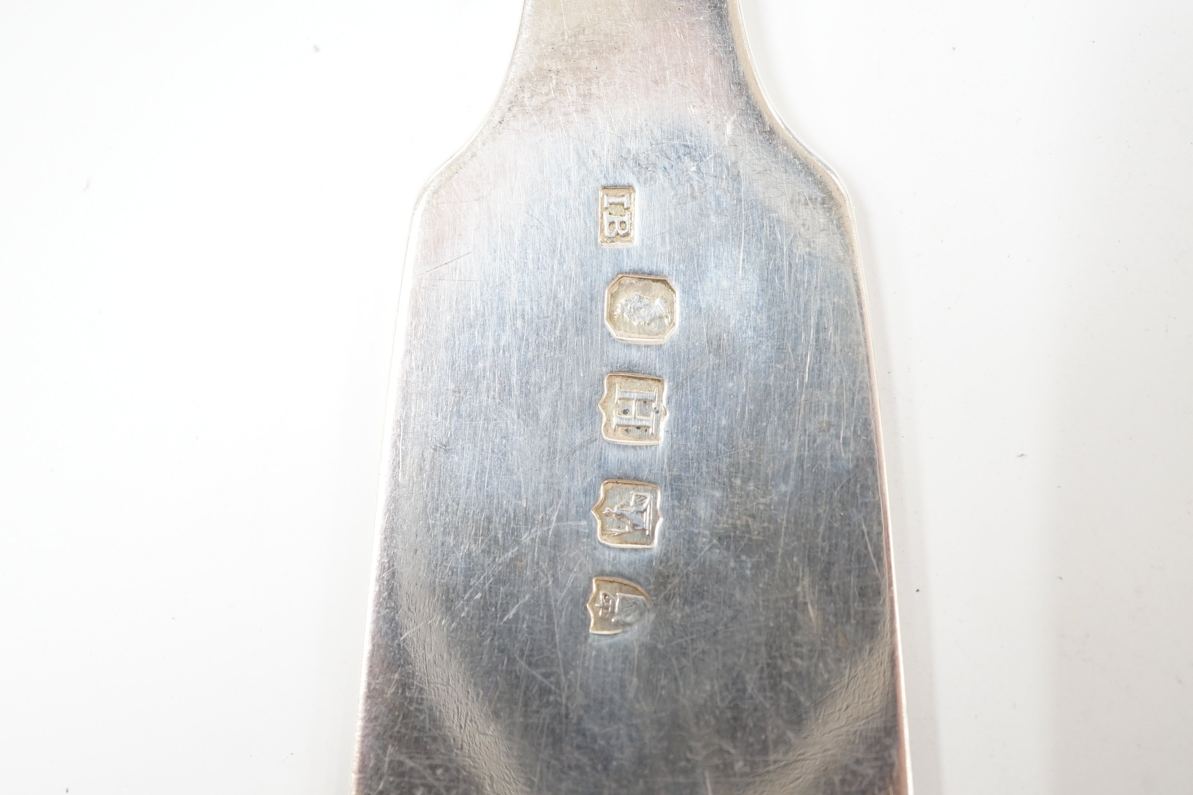 A pair of George IV Irish silver fiddle pattern basting spoons, James Brady, Dublin, 1828, 30.4cm, 7.6oz. Condition - fair